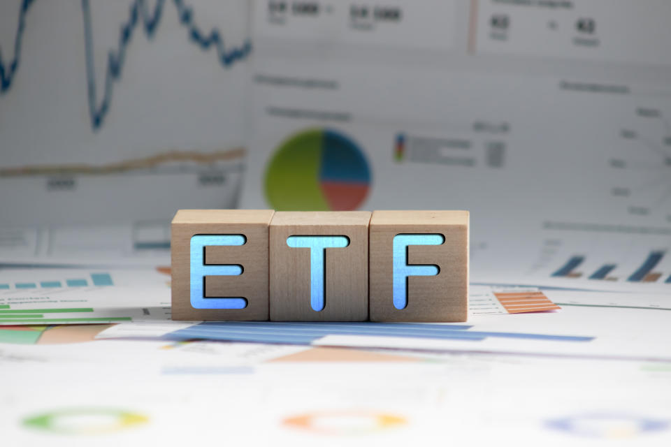 ETF or Exchange Traded Fund text on black block