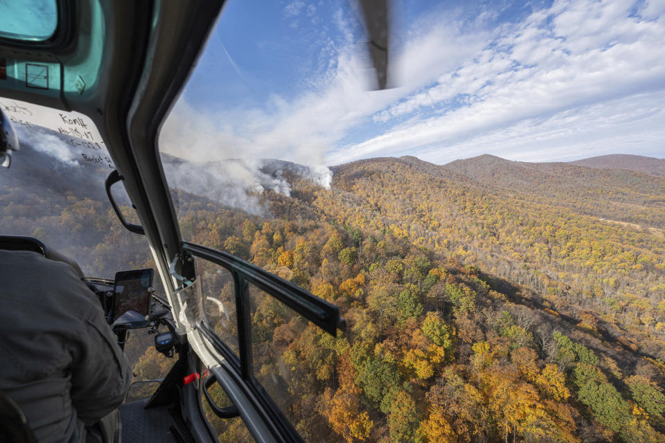 This photo provided by Virginia Department of Forestry shows the fire breached a spot in the containment lines and is slowly expanding into Shenandoah National Park and The Rapidan Tract of the Rapidan Wildlife Management Area on Nov. 5, 2023. The state Department of Forestry said a wildfire near Madison County has led officials to encourage some residents to evacuate as crews work to stop the blaze from spreading. That fire had burned nearly 2,500 acres (1,012 hectares) on Sunday, but no structures have been affected and firefighters were installing additional fire lines to maintain that, the agency said. (Virginia Department of Forestry via AP)