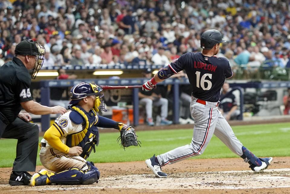 Minnesota Twins' Jordan Luplow hits a double during the fourth inning of a baseball game against the Milwaukee Brewers Tuesday, Aug. 22, 2023, in Milwaukee. (AP Photo/Morry Gash)