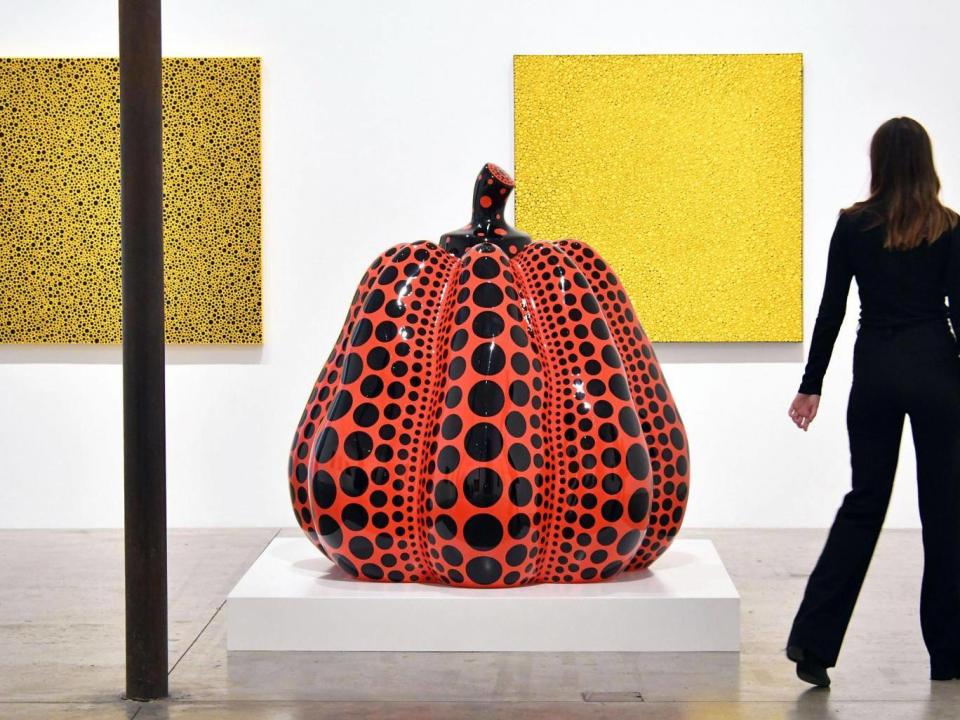 Dots Obsession (two pictures) and Pumpkin, part of The Moving Moment When I Went To The Universe at Victoria Miro in London (Rex)