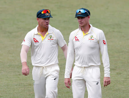 Cricket - South Africa vs Australia - First Test Match - Kingsmead Stadium, Durban, South Africa - March 5, 2018. Australia's David Warner and Steve Smith leave the pitch after beating South Africa. REUTERS/Rogan Ward/File Photo