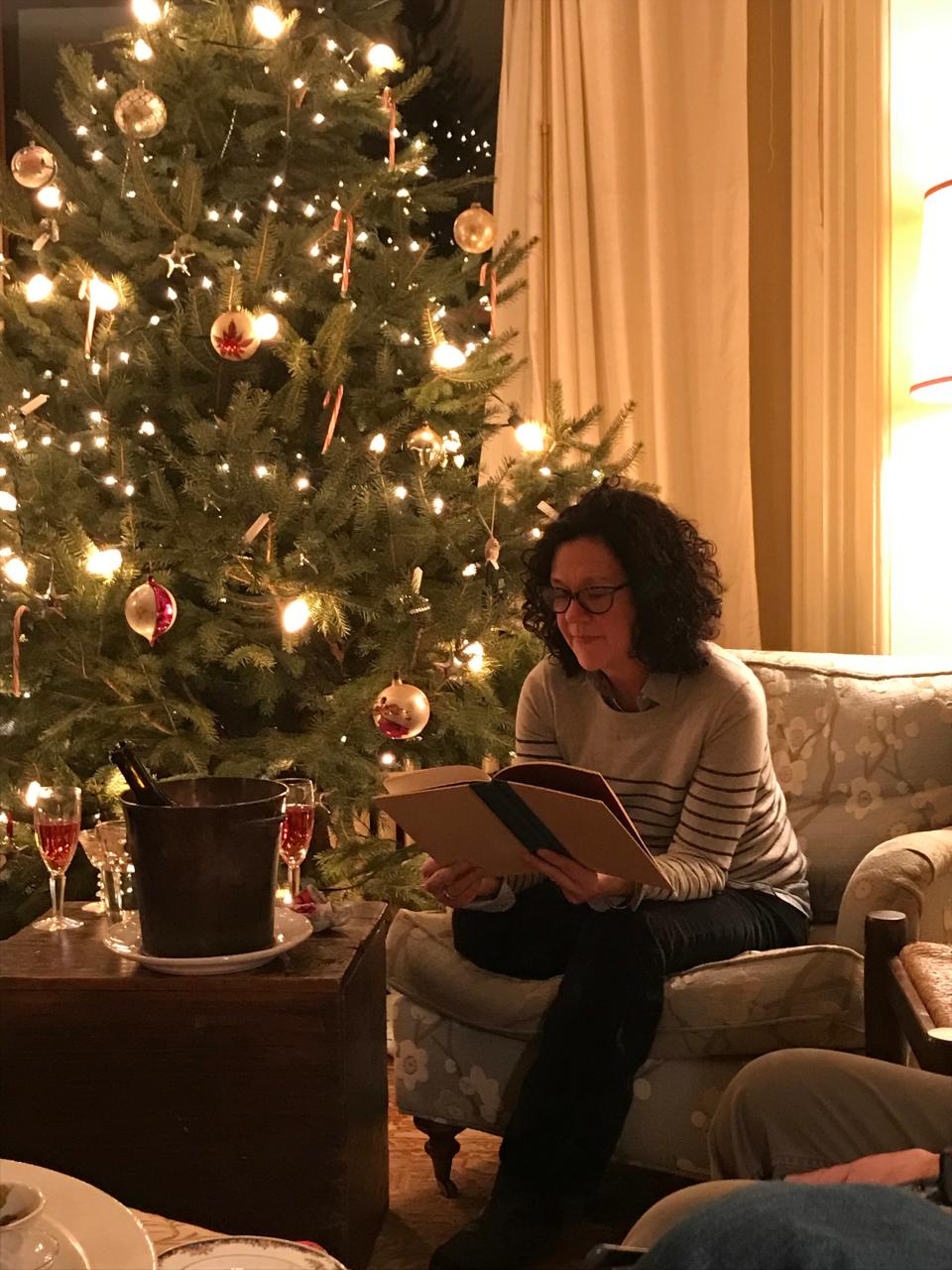 Suzie Devoe reads "A Christmas Memory" at her home in 2018.