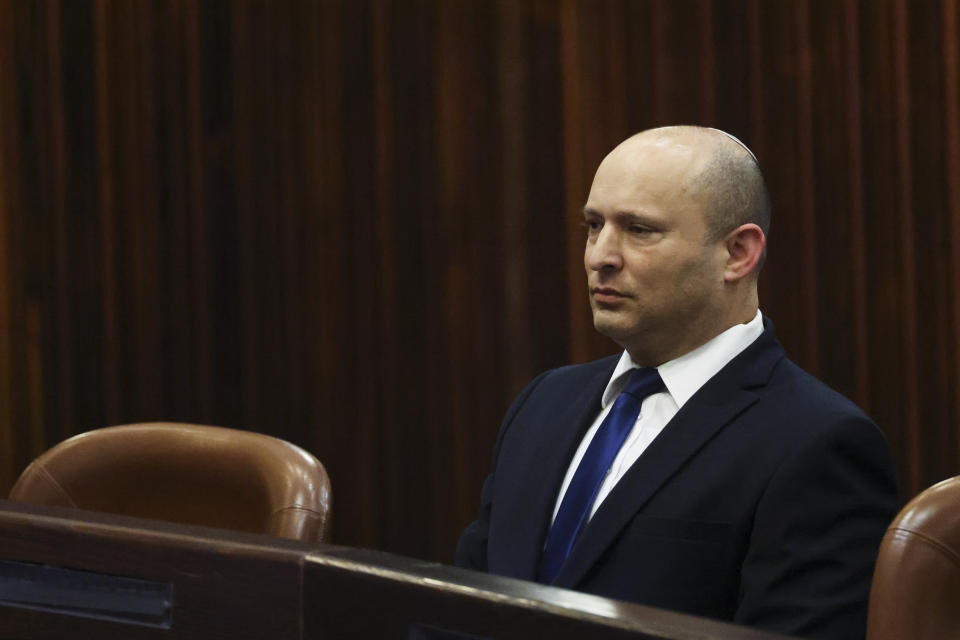 Yamina party leader Naftali Bennett looks on during a special session of the Knesset, whereby Israeli lawmakers elect a new president, at the plenum in the Knesset, Israel's parliament, in Jerusalem on Wednesday, June 2, 2021. (Ronen Zvulun/Pool Photo via AP)