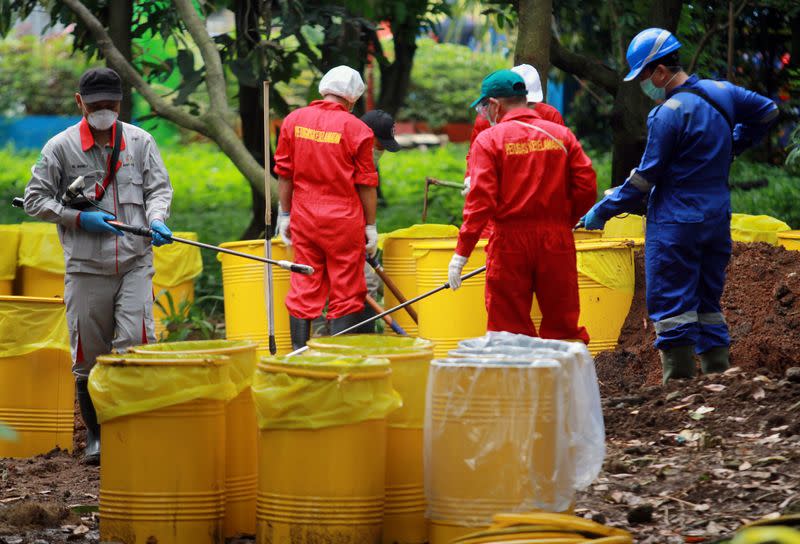 The National Nuclear Energy Agency of Indonesia (BATAN) and Nuclear Energy Regulatory Agency (BAPETEN) decontaminate the soil that is exposed to radioactive waste in the residential area of Batan Indah, Tangerang, near Jakarta