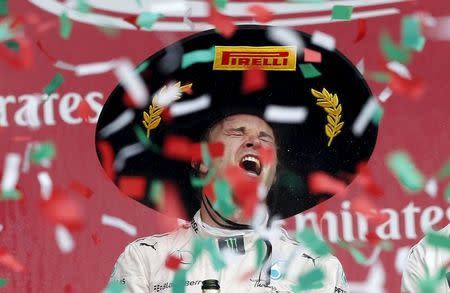 Mercedes Formula One driver Nico Rosberg of Germany celebrates after winning the Mexican F1 Grand Prix at Autodromo Hermanos Rodriguez in Mexico City, November 1, 2015. REUTERS/Edgard Garrido