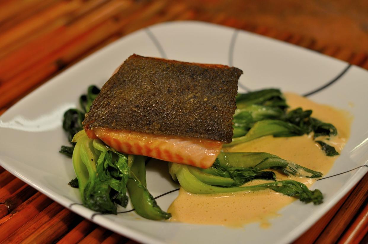 Pan Seared Salmon with Crispy Skin on Baby Bok Choy with Red Pepper and Garlic Sauce
