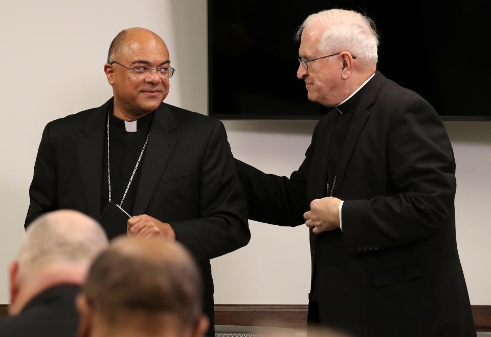 Retiring Archbishop Joseph Kurtz congratulates Archbishop Shelton Fabre as he was announced last the incoming Archbishop of Louisville.
