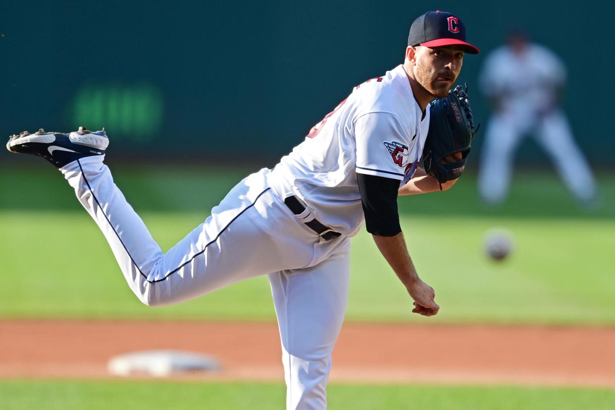 Cleveland Guardians starting pitcher Aaron Civale watches a throw during the first inning of the team's baseball game against the Chicago White Sox, Wednesday, July 13, 2022, in Cleveland. (AP Photo/David Dermer)