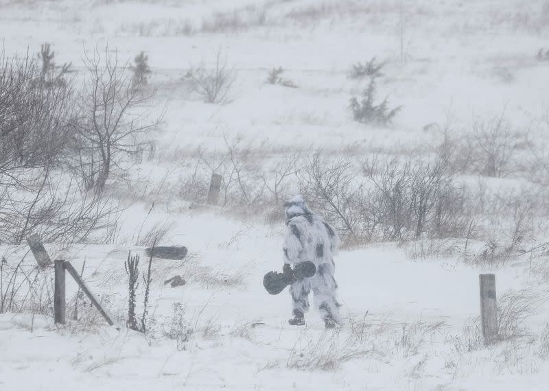 A Ukrainian service member holds a NLAW missile during drills in the Lviv region