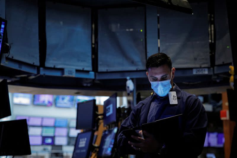 A trader works on the floor of the NYSE in New York