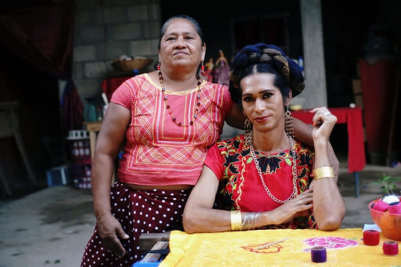 Estrella Vasquez, a muxe woman who features on the cover of Vogue magazine, poses for a photo with her mother Maria de Jesus Guerra at their house in Juchitan