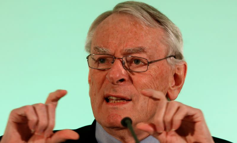 FILE PHOTO: WADA former president, Pound, who heads the commission into corruption and doping in athletics, gestures at a news conference in Unterschleissheim