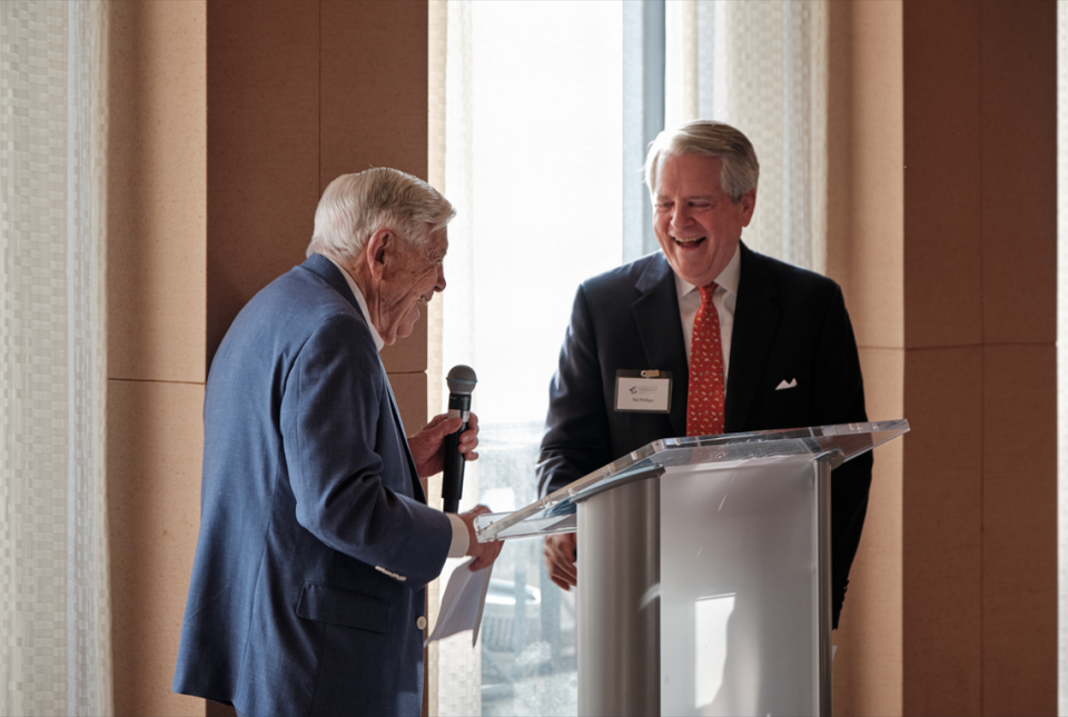 At a Charlotte Symphony event April 2, 2024, at Bank of America headquarters, honorary CSO capital campaign chair Hugh McColl, left, and campaign chair Pat Phillips share a laugh. McColl is the bank’s former CEO and Phillips is a former executive at the bank.