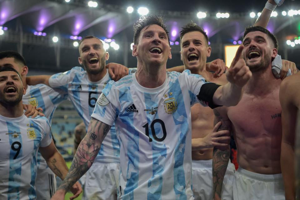 Argentina's Lionel Messi (C) and teammates celebrate after winning the Conmebol 2021 Copa America football tournament final match against Brazil at Maracana Stadium in Rio de Janeiro, Brazil, on July 10, 2021. - Argentina won 1-0. (Photo by CARL DE SOUZA / AFP) (Photo by CARL DE SOUZA/AFP via Getty Images)