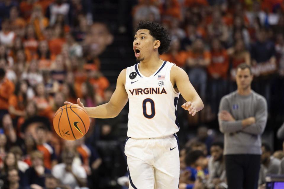 Virginia's Kihei Clark (0) calls out a play against Duke during the second half of an NCAA college basketball game in Charlottesville, Va., Saturday, Feb. 11, 2023. (AP Photo/Mike Kropf)
