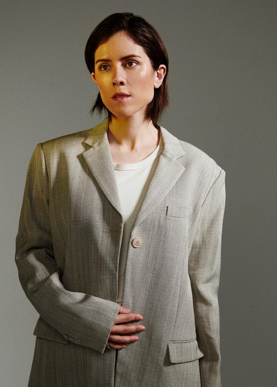 <cite class="credit">(Tegan) T-shirt, $110, by Jenni Kanye / Jacket, price upon request, by Jacquemus</cite>