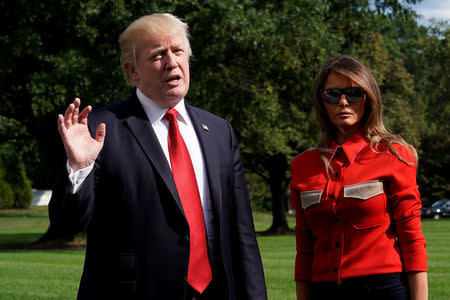 U.S. President Donald Trump talks to the media about Hurricane Irma, next to First lady Melania Trump, on the South Lawn of the White House upon their return to Washington, U.S., from Camp David September 10, 2017. REUTERS/Yuri Gripas