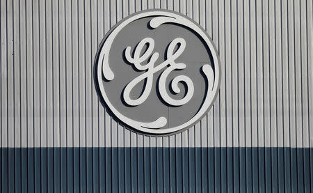 FILE PHOTO: The logo of U.S. conglomerate General Electric is pictured at the company's site of its energy branch in Belfort, France, February 5, 2019. REUTERS/Vincent Kessler/File Photo