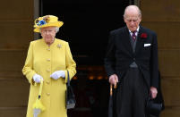 <p>Queen Elizabeth II and Prince Philip, Duke of Edinburgh observe a minute’s silence in honour of the victims of the attack at Manchester Arena at the start of a garden party at Buckingham Palace on May 23, 2017 in London, England. (Dominic Lipinski – WPA Pool/Getty Images) </p>