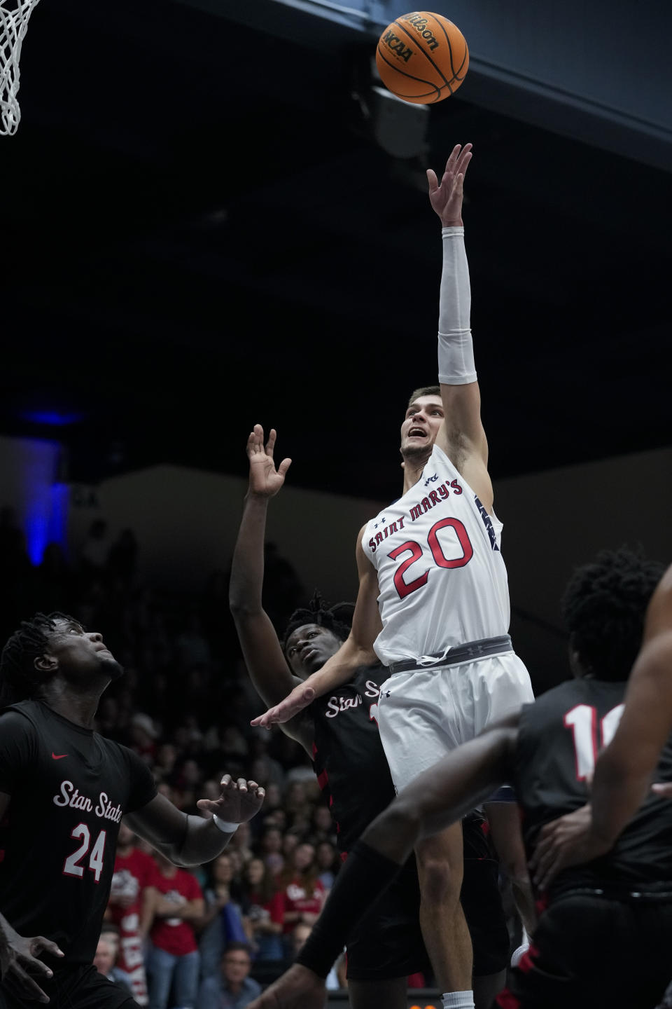 Saint Mary's guard Aidan Mahaney (20) shoots the ball during the first half of an NCAA college basketball game against Cal State Stanislaus Monday, Nov. 6, 2023, in Moraga, Calif. (AP Photo/Godofredo A. Vásquez)