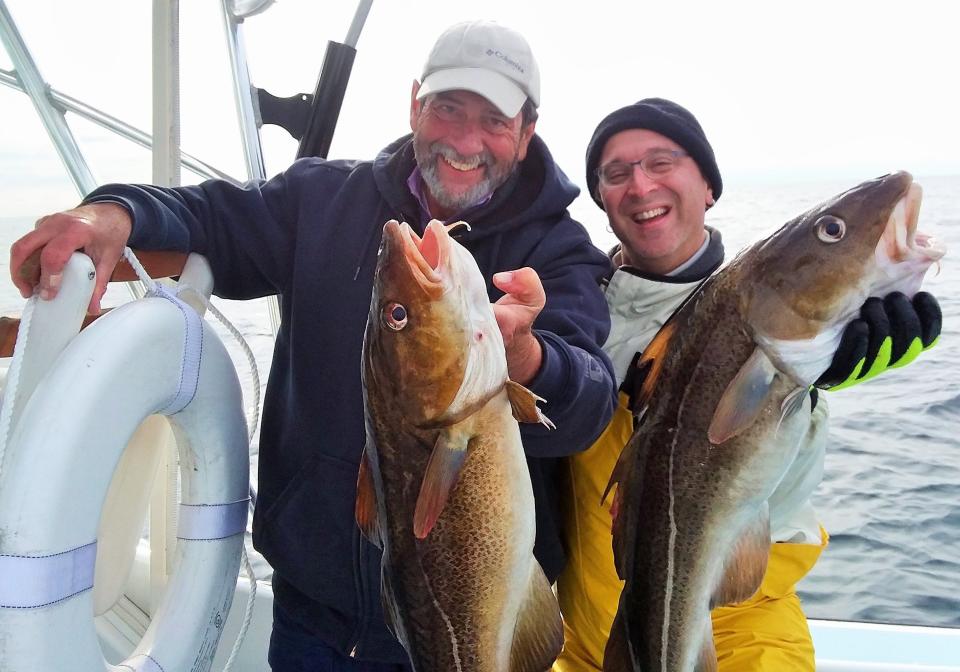 Capt. Dave Monti, left, and Steve Brustein of Warwick with cod from the Block Island Wind Farm area. The will to rebuild Atlantic cod will be tested again as managers consider them in four distinct stocks.