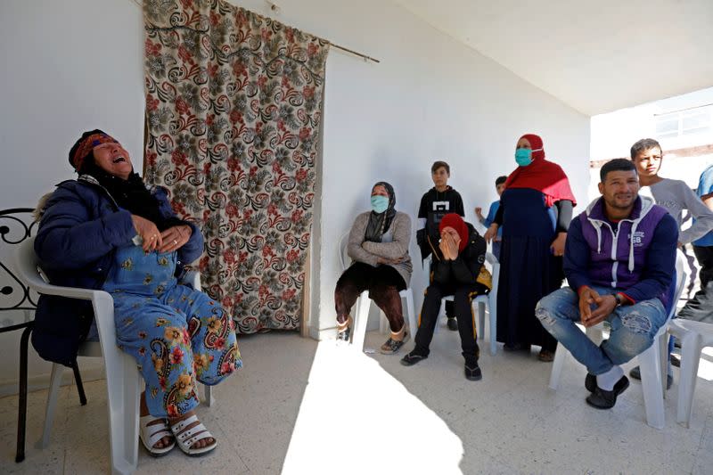 Gamra, the mother of Brahim Aouissaoui, who is suspected of carrying out Thursday's attack in Nice, France, reacts at her home in Thina, a suburb of Sfax, Tunisia