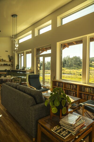 The prefabs have a long, spacious living space that gets plenty of natural light from a wall of windows.