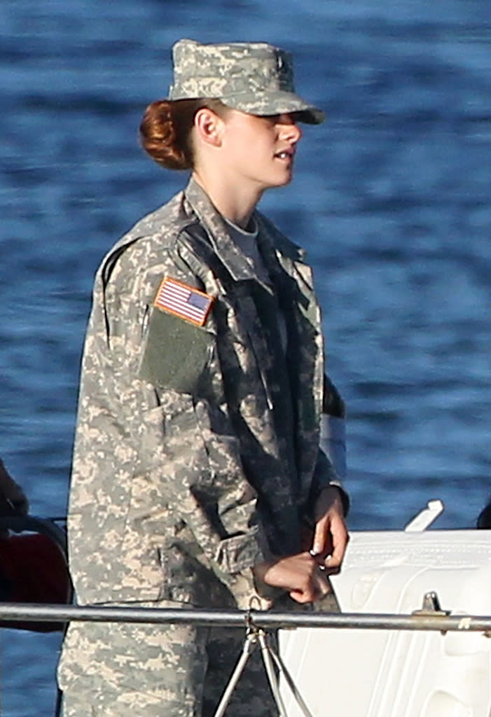 Kristen Stewart, dressed in full military uniform, films scenes for her upcoming movie 'Camp X-Ray' in Los Angeles