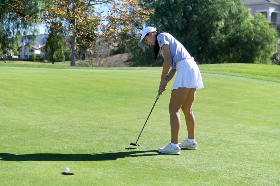 Oak Park's Derica Chiu sinks a birdie putt on the second hole at Wood Ranch Golf Club in Simi Valley on Nov. 23. Chiu is The Star's Girls Golfer of the Year after a sensational senior season.