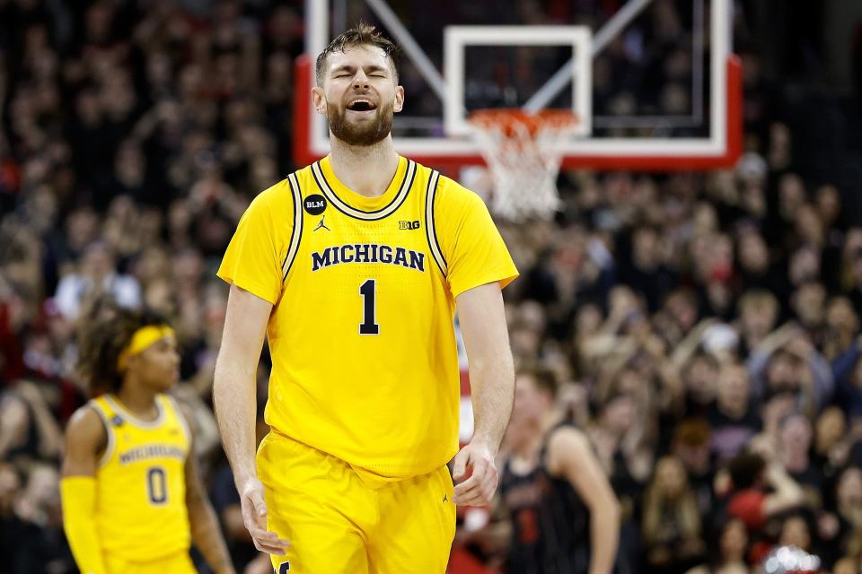 Michigan center Hunter Dickinson reacts to a call while walking down court during the second half during the second half of U-M's 64-59 loss on Tuesday, Feb. 13, 2023, in Madison, Wisconsin.
