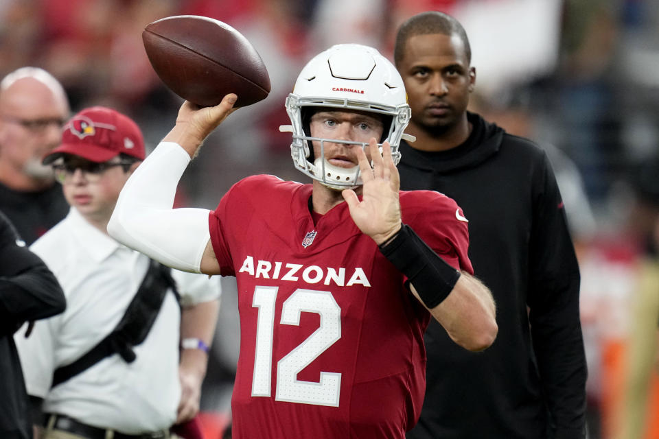 Arizona Cardinals quarterback Colt McCoy (12) warms up prior to an NFL preseason football game against the Kansas City Chiefs, Saturday, Aug. 19, 2023, in Glendale, Ariz. (AP Photo/Ross D. Franklin)