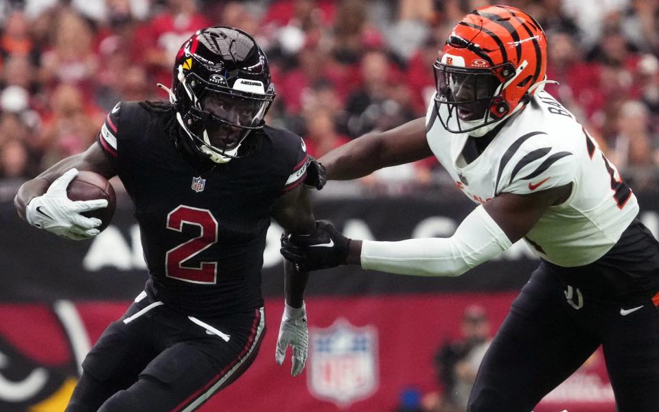 Arizona Cardinals receiver <a class="link " href="https://sports.yahoo.com/nfl/players/31857" data-i13n="sec:content-canvas;subsec:anchor_text;elm:context_link" data-ylk="slk:Marquise Brown;sec:content-canvas;subsec:anchor_text;elm:context_link;itc:0">Marquise Brown</a> (2) tries to get past <a class="link " href="https://sports.yahoo.com/nfl/teams/cincinnati/" data-i13n="sec:content-canvas;subsec:anchor_text;elm:context_link" data-ylk="slk:Cincinnati Bengals;sec:content-canvas;subsec:anchor_text;elm:context_link;itc:0">Cincinnati Bengals</a> safety <a class="link " href="https://sports.yahoo.com/nfl/players/40117" data-i13n="sec:content-canvas;subsec:anchor_text;elm:context_link" data-ylk="slk:Jordan Battle;sec:content-canvas;subsec:anchor_text;elm:context_link;itc:0">Jordan Battle</a> (27) at State Farm Stadium in Glendale on Oct. 8, 2023.