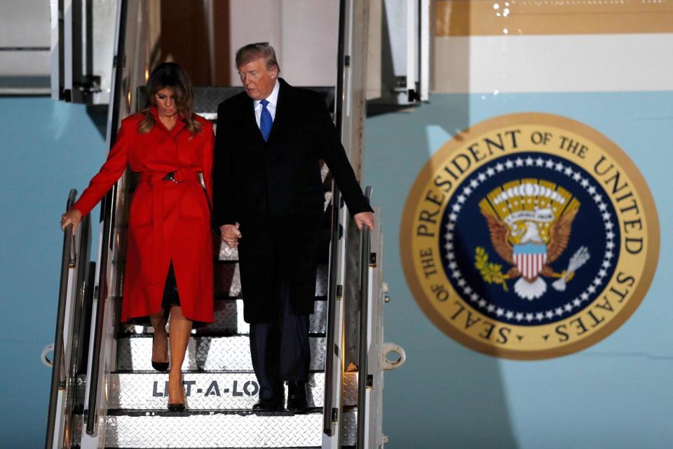 Donald Trump and First Lady Melania Trump disembark Air Force One after landing at Stansted Airport (AFP via Getty Images)