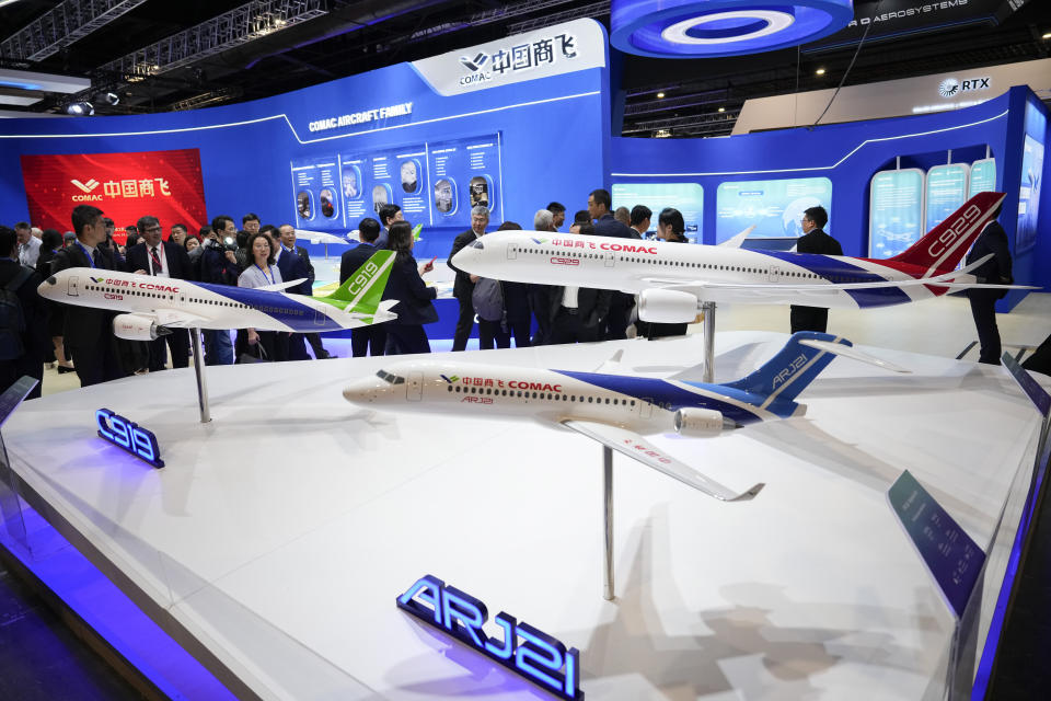 Aircraft models of China's COMAC C919 and AR J21 are on display at the COMAC pavilion during the first day of the Singapore Airshow in Singapore, Tuesday, Feb. 20, 2024. (AP Photo/Vincent Thian)