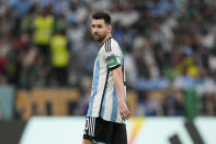 Argentina's Lionel Messi walks during the World Cup group C soccer match between Argentina and Mexico, at the Lusail Stadium in Lusail, Qatar, Saturday, Nov. 26, 2022. (AP Photo/Ariel Schalit)