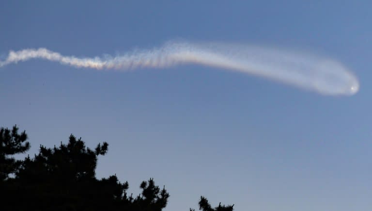 A vapour trail believed to be created by a North Korean ballistic missile is seen from South Korea's Yeonpyeong island on Wednesday (-)