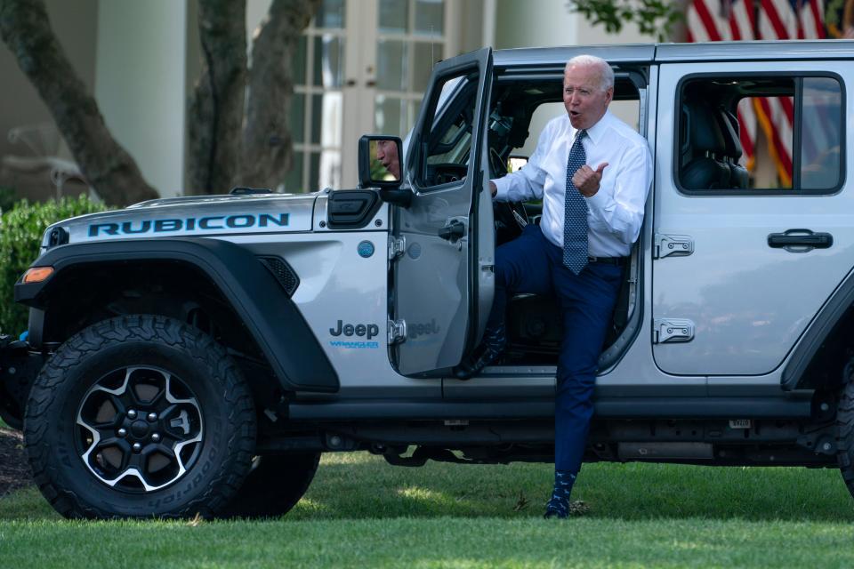 President Joe Biden gets out of a Jeep Wrangler Rubicon 4xE on the South Lawn of the White House in Washington, Thursday, Aug. 5, 2021, during an event on clean cars and trucks. (AP Photo/Evan Vucci) ORG XMIT: DCEV102