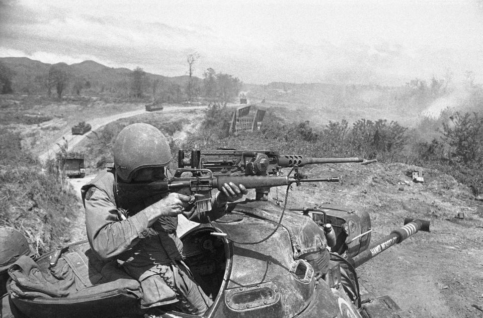 A soldier uses his M16 during a battle in the Vietnam War in 1971.