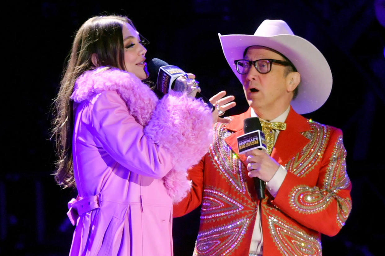 Elle King and Rob Schneider speak onstage (Jason Davis / Getty Images file)