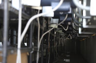 Some of the processors used for bitcoin calculations fill a container at the La Geo Geothermal Power Plant in Berlin municipality, Usulutan department, El Salvador, Friday, Oct. 15, 2021. The government announced that it has installed 300 processors at this plant to "mine" cryptocurrency, and is using geothermal resources from the country’s volcanos to run the computers that perform the calculations to verify transactions in bitcoin, recently made legal tender. (AP Photo/Salvador Melendez)