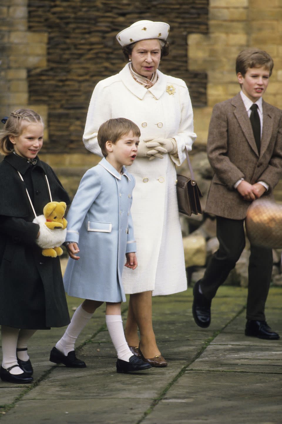 <p>The Queen walks with Zara Phillips and Prince William at Sandringham House.</p>