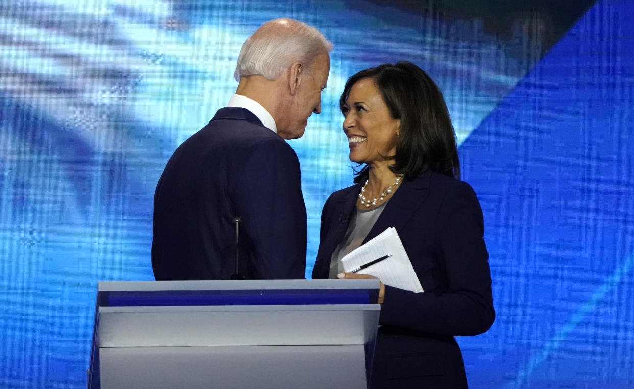 Former Vice President Joe Biden talks with Sen. Kamala Harris after the conclusion of a Democratic debate in Houston, Sept. 12, 2019. (Mike Blake/Reuters)