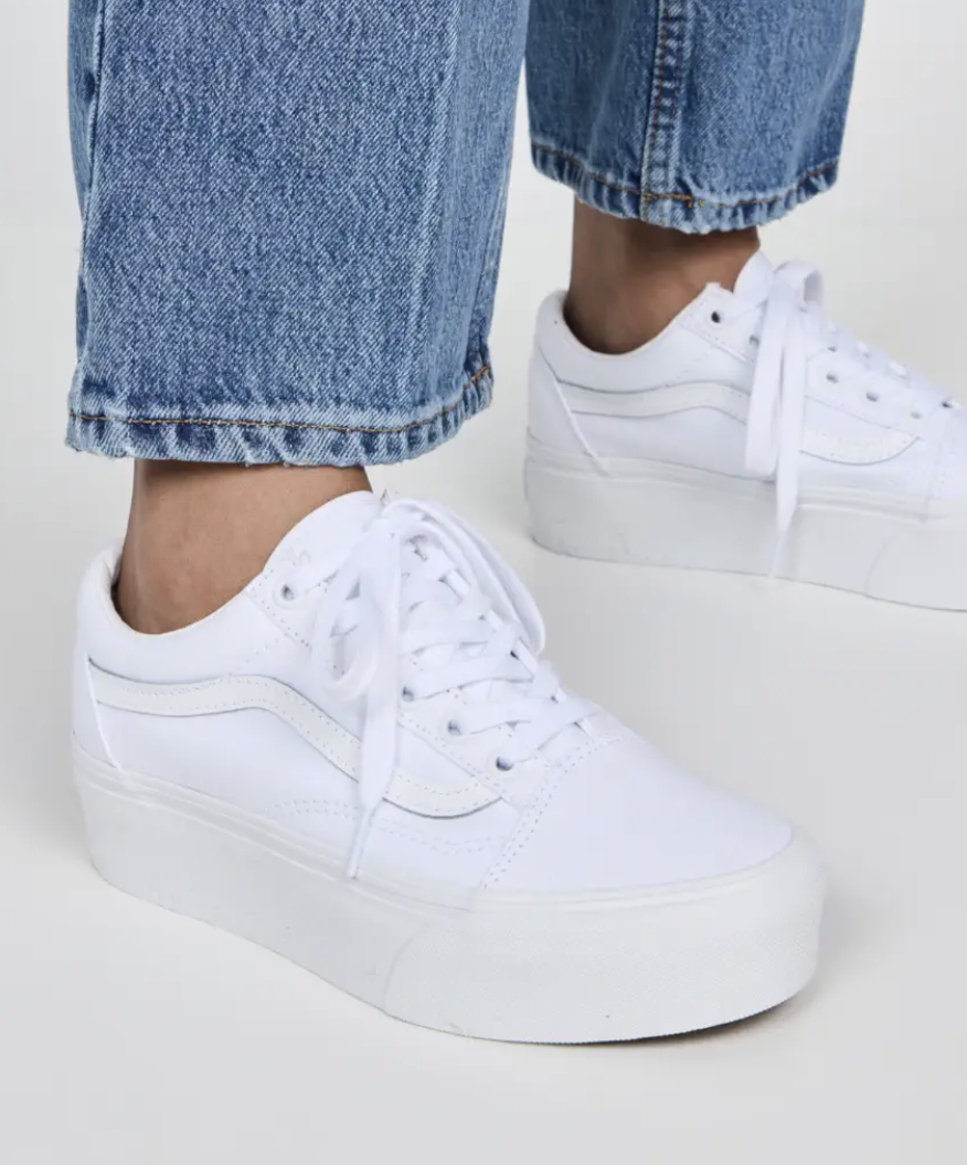 model wearing platform white sneakers