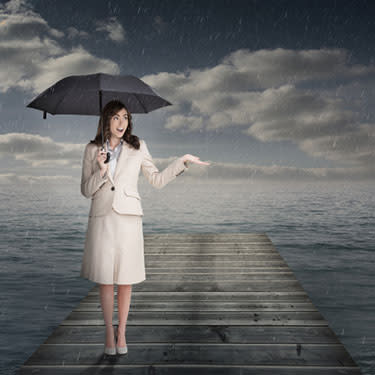 Elegant businesswoman holding an umbrella web