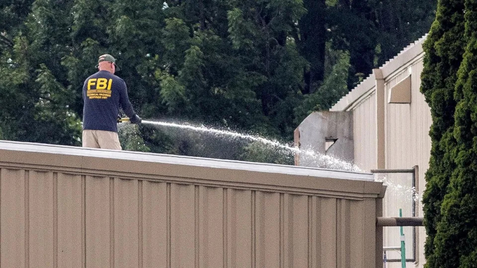 PHOTO: An FBI investigator hoses off a rooftop where a gunman had been positioned during former U.S. President Donald Trump's campaign rally in Butler, Pennsylvania, on July 14, 2024. (Carlos Osorio/Reuters)