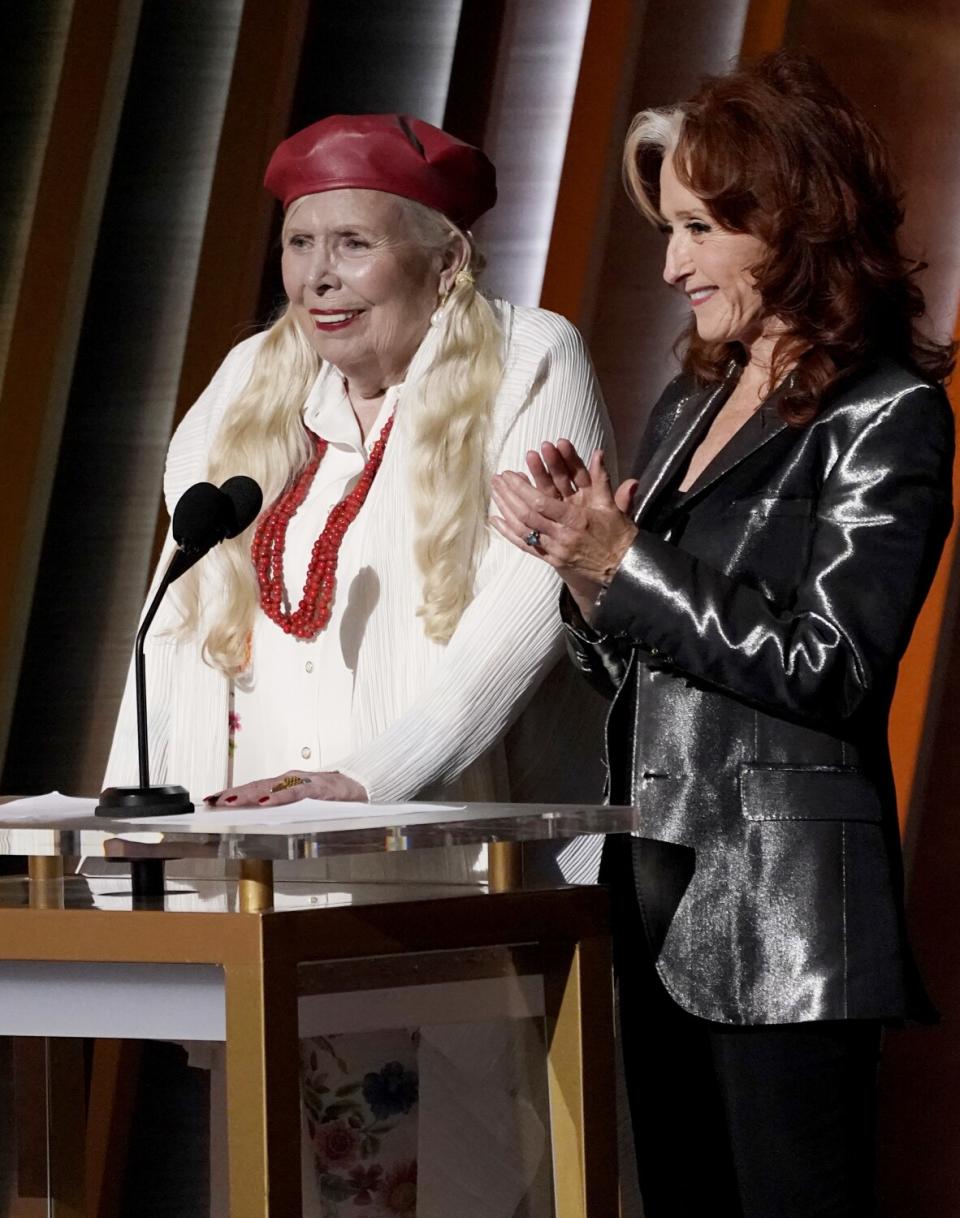 Joni Mitchell, left, and Bonnie Raitt.