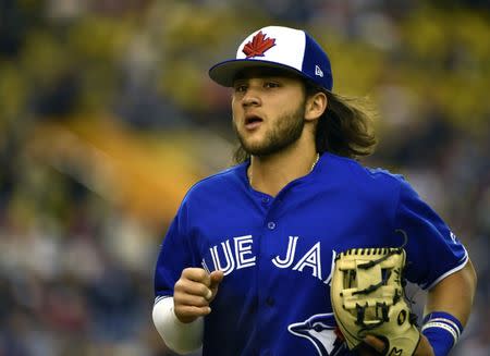 FILE PHOTO: Mar 26, 2019; Montreal, Quebec, CAN; Toronto Blue Jays infielder Bo Bichette (66) runs back to the dugout in the seventh inning during a spring training game against the Milwaukee Brewers at Olympic Stadium. Mandatory Credit: Eric Bolte-USA TODAY Sports