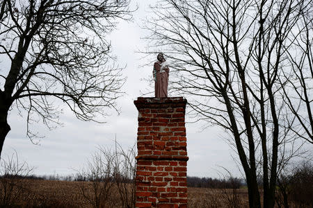 A holy statue stands near the Church of Saint Jacob in Ostrowite village, Poland February 17, 2019. Picture taken February 17, 2019. REUTERS/Kacper Pempel