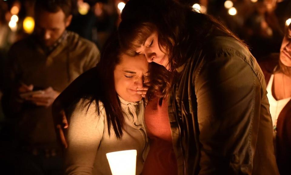 Mourners react during a vigil in Roseburg, Oregon, in 2015, for 10 people killed and seven others wounded in a shooting at a community college.