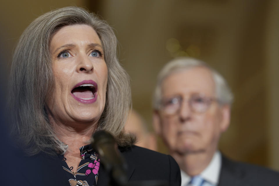 Sen. Joni Ernst, R-Iowa, speaks as Senate Minority Leader Mitch McConnell, of Ky., right, listens during a news conference at the Capitol,, Wednesday, Sept. 7, 2022, in Washington. (AP Photo/Mariam Zuhaib)